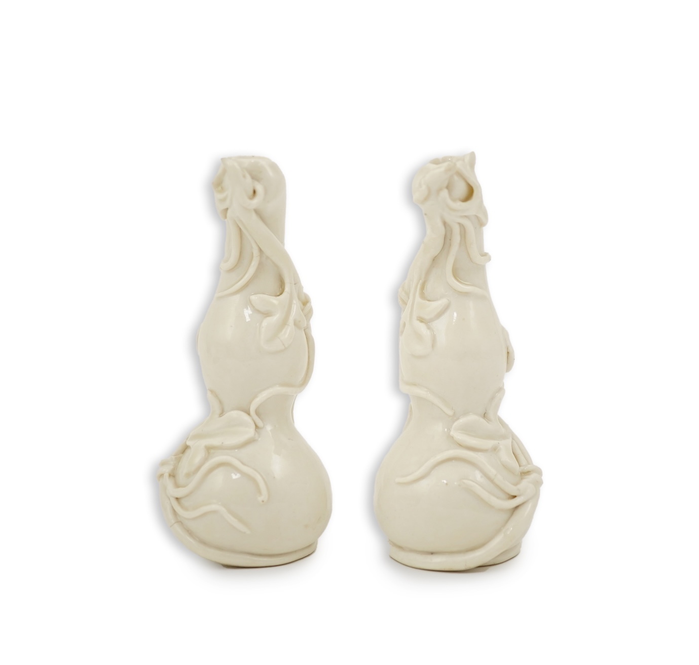 A pair of Chinese blanc-de-chine gourd-shaped vases, Dehua kilns, Qing dynasty